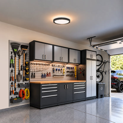 Artika Callisto 15 in. (38 cm) Modern LED Flush Mount Ceiling Light 5 CCT installed in a garage with organized wall-mounted tools and cabinetry.