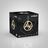 A black box featuring the Artika logo and an image of a modern, gold geometric pendant light fixture. The packaging highlights features such as 30,000 hours lifespan and 2200 lumens brightness.