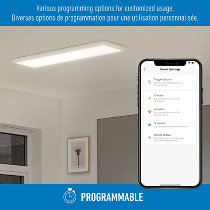An Artika Skyshade smart RGB LED light panel illuminates a minimal room. A smartphone shows customizable settings in English and French. Programmable appears below, highlighting flexible control options.