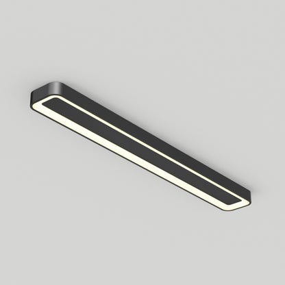 The Artika Aiden 48 in. LED modern flush mount light features a rectangular black design with rounded corners and a glowing white border, seamlessly installed on a plain light gray ceiling.