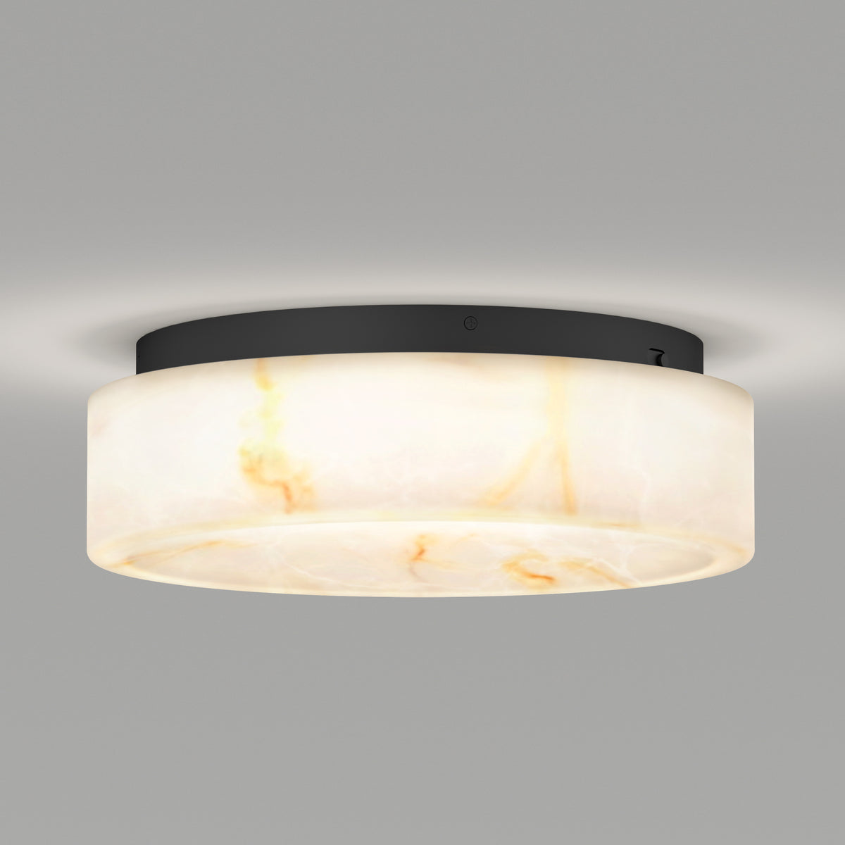 The Artika Clifford 15 in. flush mount light features a modern round design with a frosted white marbled shade, black base, and 5 CCT options, emitting a soft glow against a plain gray background.