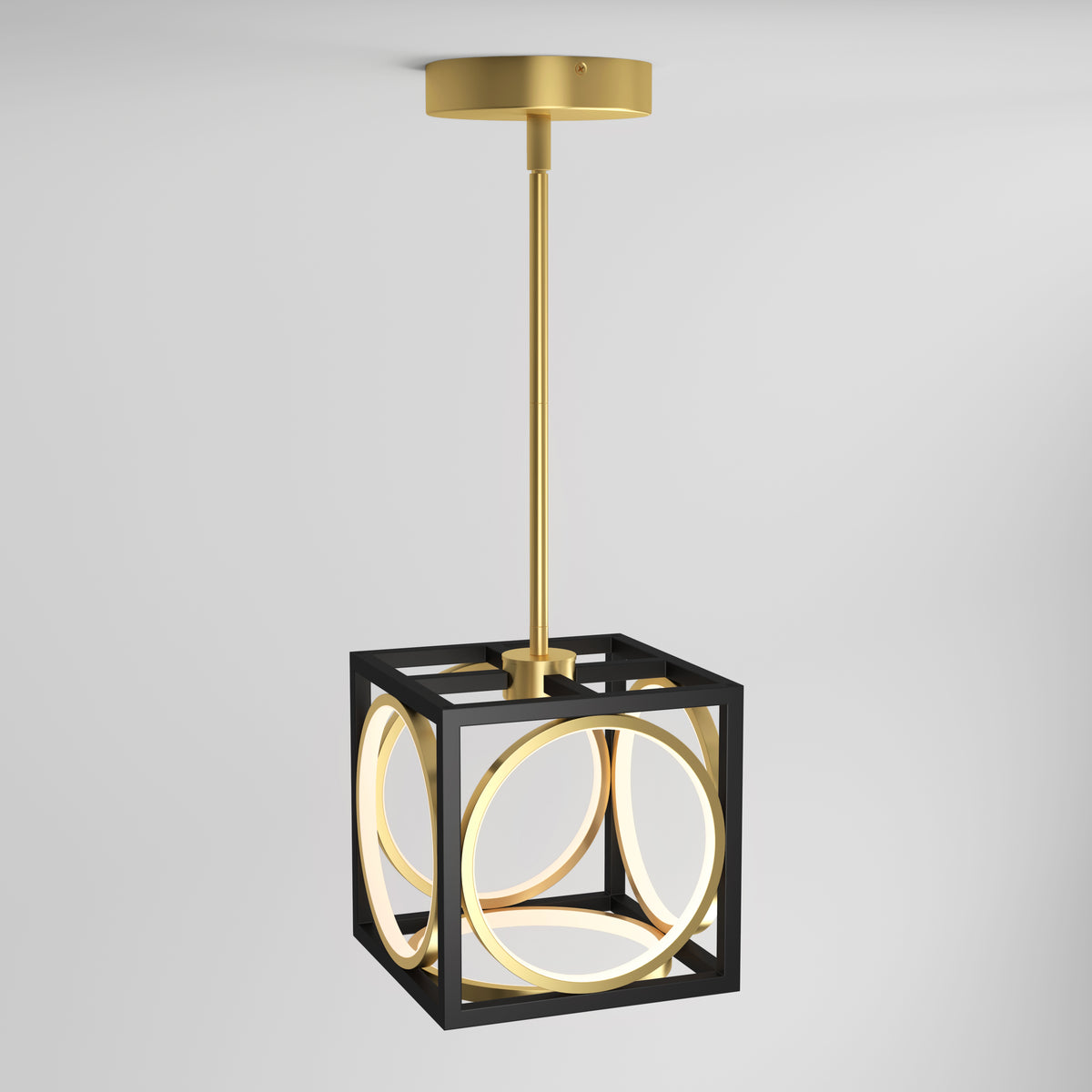 A modern pendant light featuring a gold rod and ceiling mount, with a black cubic frame enclosing intersecting gold rings that glow with warm LED light, hanging against a plain white background.