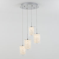 The Artika Crystal Cube 4-light LED pendant light features four textured, crystal-like cylindrical pendants at varying lengths, suspended from a round metallic base for a modern look.