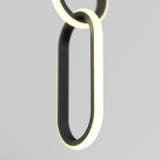 A close-up of two interlocking, oval-shaped black rings with illuminated white edges, suspended against a plain light grey background. The design is minimalistic and modern.