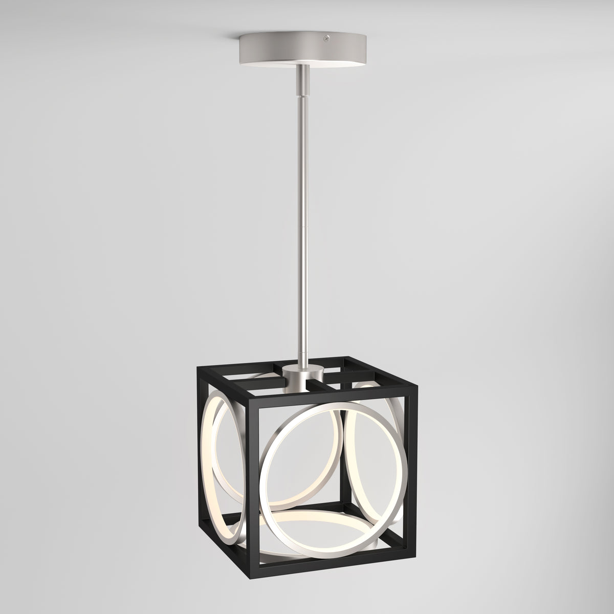 The Astoria LED modern pendant light by Artika showcases a black cube frame with intersecting circular LEDs, suspended from a sleek silver rod and mount, set against a plain white background.