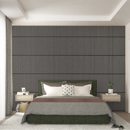 A modern bedroom features a large bed, two floating nightstands with lamps, and an Artika Sonolok 15.5 ft sound-absorbing wall panel kit (4-pack) as a textured accent wall with vertical lines behind the bed. Slippers rest near the bed.