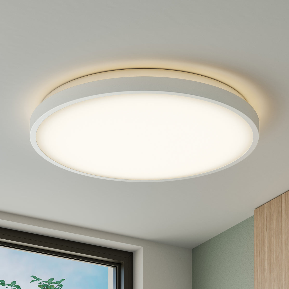 The Artika Isara 15 in. RGBIC LED Flush Mount lights up a bright room with a glimpse of window and cabinet in view.