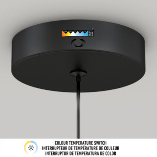 The image shows the Artika Hanson 1-light LED pendant, a black ceiling-mounted fixture with a color temperature switch and indicator. Below is a label displaying Colour Temperature Switch in English, French, and Spanish with a sun icon.