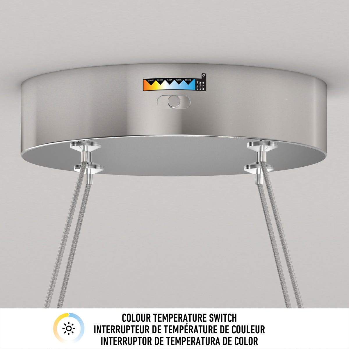 A close-up of the Artika Vanora LED pendant light 5 CCT shows its color temperature switch, indicator displaying various CCT options, and three cables extending from the bottom of the fixture.