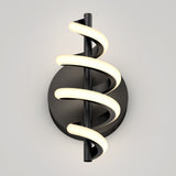A modern wall sconce with a black circular base and a vertical black rod, around which a glowing, spiral-shaped LED light wraps, creating a sleek, contemporary look against a light gray background.
