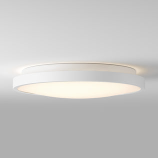 Artika Isara 12 in. RGBIC LED flush mount with interchangeable trim softly lights up a plain gray ceiling with modern, minimal style.