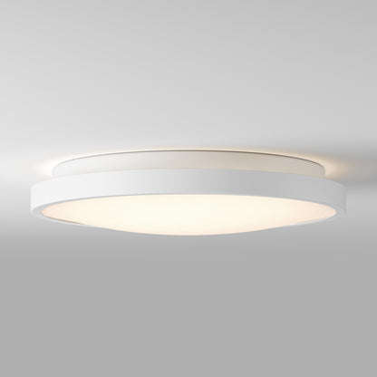 Artika Isara 12 in. RGBIC LED flush mount with interchangeable trim softly lights up a plain gray ceiling with modern, minimal style.
