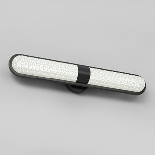 The Artika Carat LED vanity light features 3 CCT, a black frame, and textured white diffuser, shown on a plain gray background.
