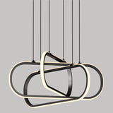 A modern pendant light fixture with three overlapping, oval-shaped LED rings suspended from the ceiling by thin black cords, set against a plain gray background.