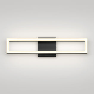 The Artika Dover 27-in Integrated LED 5-CCT Vanity Light Bar features a modern rectangular design with a glowing frame, chrome finish, and black central mounting plate, displayed against a plain light-colored wall.