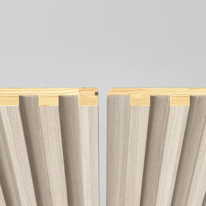 Two Artika Panolok 30.67 ft wall panel kit sections in beige feature wood-paneled, wavy grooved surfaces and interlocking edges, displayed side by side on a light gray background with natural wood tops.