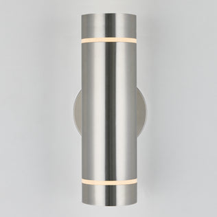 The Artika C7 indoor-outdoor wall light is a modern, rustproof cylindrical fixture in brushed metal with subtle top and bottom light bands, mounted on a plain light-colored wall—perfect for versatile indoor or outdoor use.