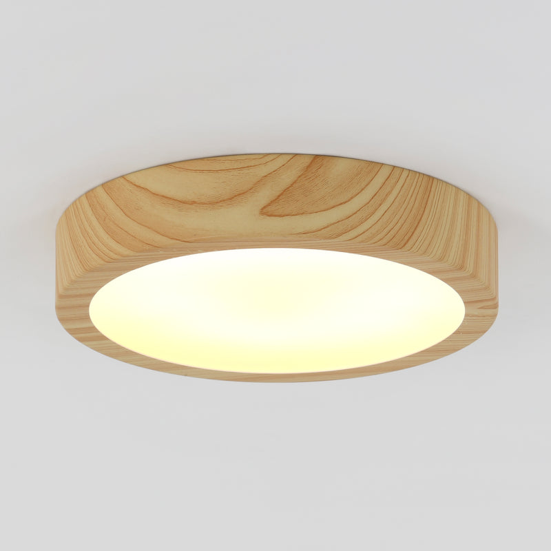The Artika Dryad 10 in. Modern LED Flush Mount Ceiling Light softly illuminates a plain white ceiling with its sleek, minimalist design.