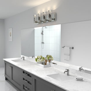 Modern bathroom with marble double sink, gray cabinets, chrome-framed mirror, and Artika Essence 27-in LED vanity light above.