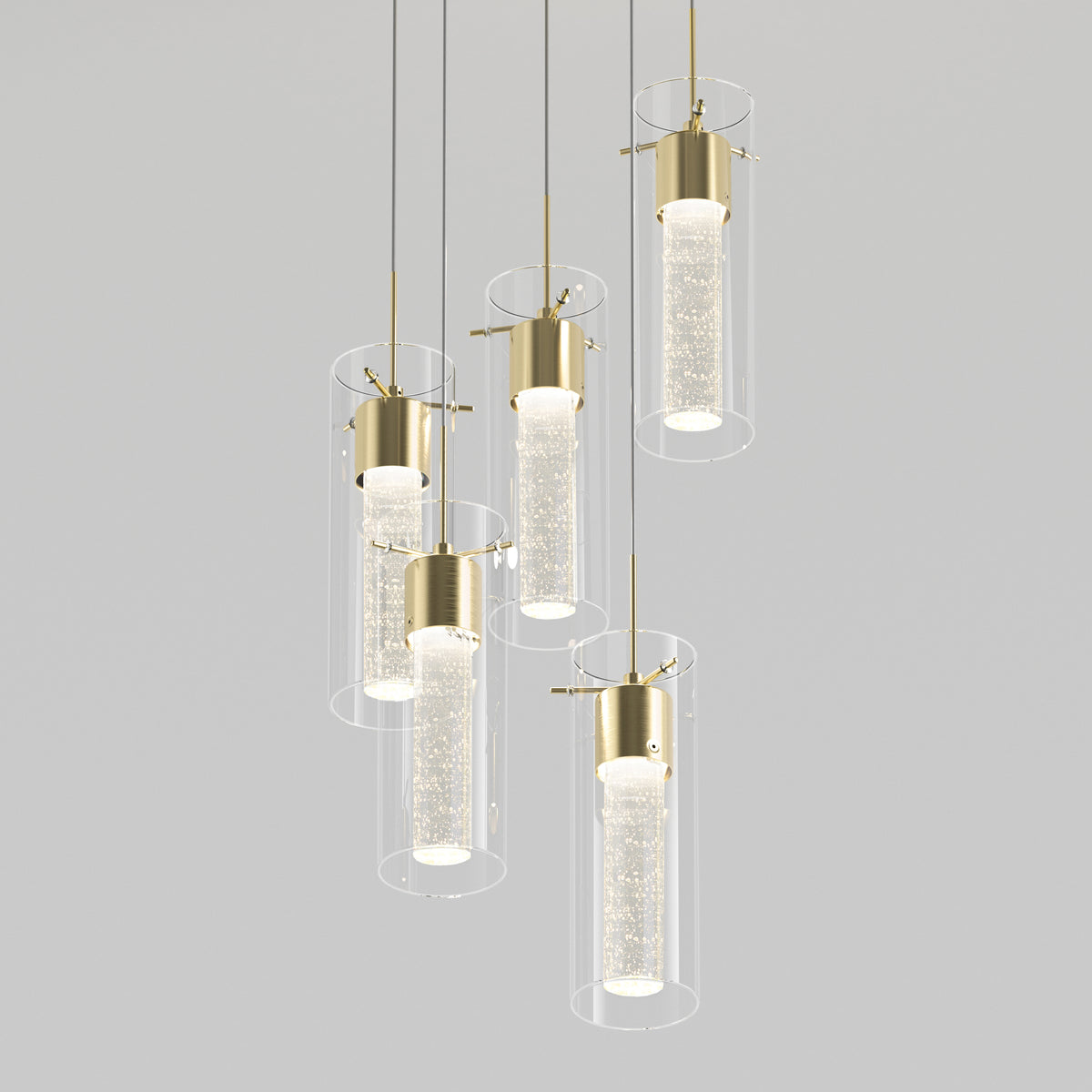 The Artika Essence 5-light LED pendant features modern cylindrical glass shades with gold fittings, each hanging at different heights. Inner tubes contain small bubbles for a sparkling, illuminated effect.