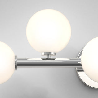 Close-up of the Artika Bloom 27-in (69 cm) 3-Light Modern LED Vanity Light for Bathroom, featuring three frosted glass globes and a chrome base—perfect for stylish bathroom lighting.