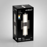 A black rectangular box displays the Artika Dorado LED wall sconce, featuring an image of the modern light fixture with vertical LED tubes and a central metallic bracket. Various product features are shown on the box.