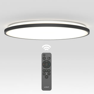 The Artika Europa 21 in. LED modern flush mount light features a black-rimmed, circular design and comes with a remote control for wireless operation, as shown illuminated above its multi-button remote.