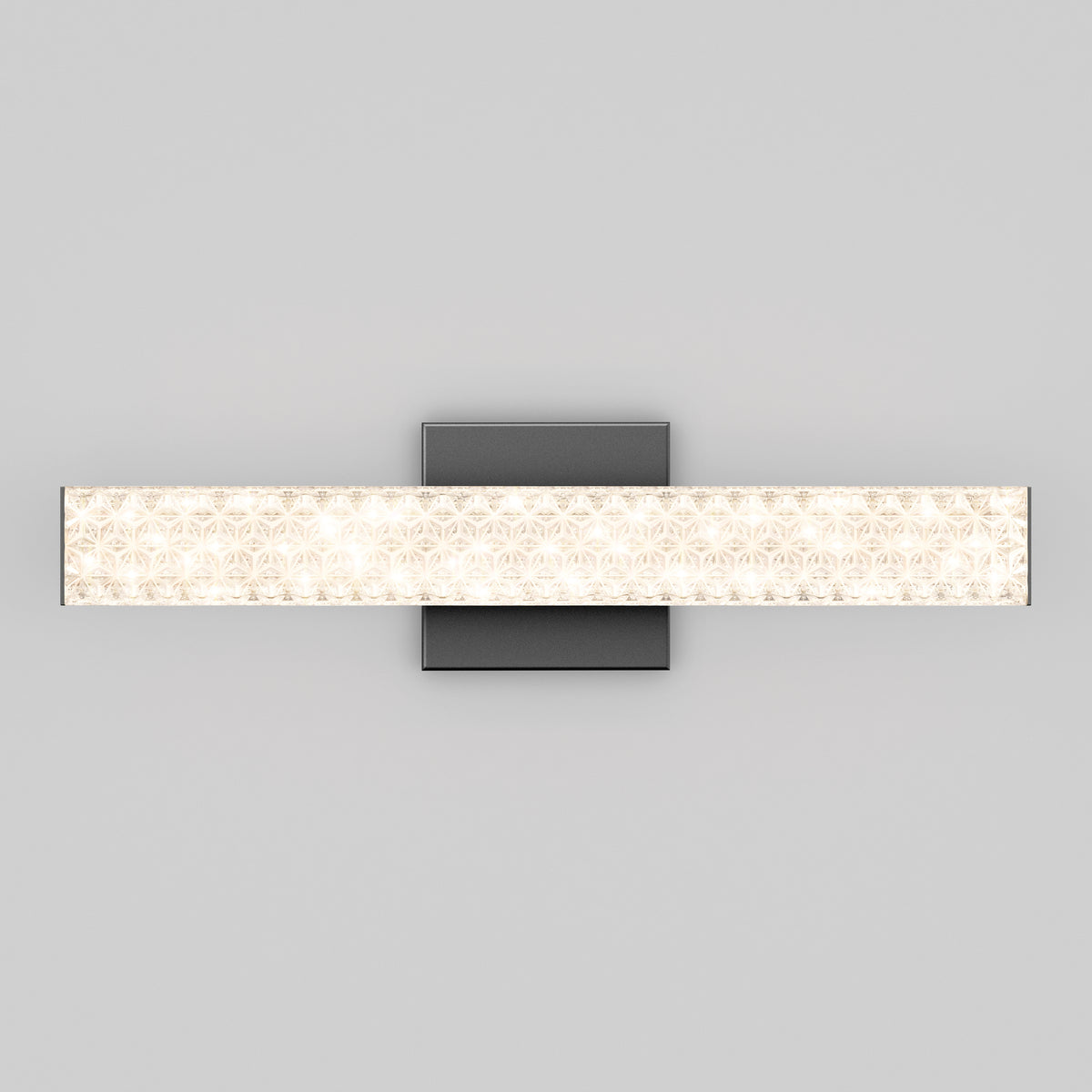 A modern wall-mounted light fixture with a rectangular frosted glass shade and a textured pattern, attached to a square metallic base against a plain light gray background.