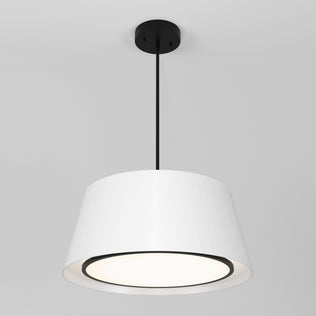 The Artika Cappa LED pendant light 3 CCT features a modern white drum shade with a black ceiling mount and cord, illuminated against a plain light gray background, casting a soft downward glow.