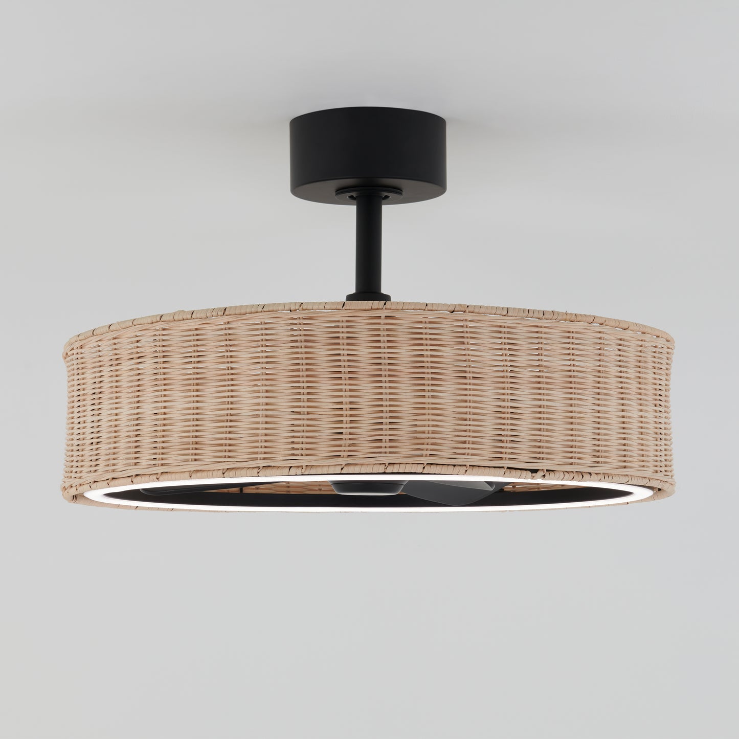 The Artika Kalani 24 in. LED modern ceiling fan features a round woven rattan shade, black metal base, and remote control for 3 speeds—blending natural and modern elements for your ceiling.