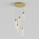 A modern ceiling pendant light featuring five cylindrical glass fixtures with gold accents, suspended at different heights from a round gold ceiling mount. The lights have a textured inner tube that diffuses the light.