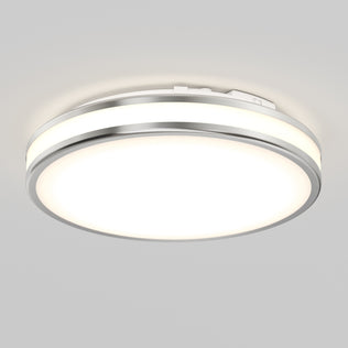 The Artika Hemisphere 15 in. LED flush mount light features a modern design with a metallic rim and frosted diffuser, offering 5 CCT options for perfect bathroom lighting and a soft, even glow when mounted on a white ceiling.