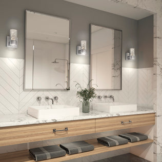 Modern bathroom with two sinks, large mirrors, Artika Essence LED vanity lights, marble counter, and towels on wooden shelves.