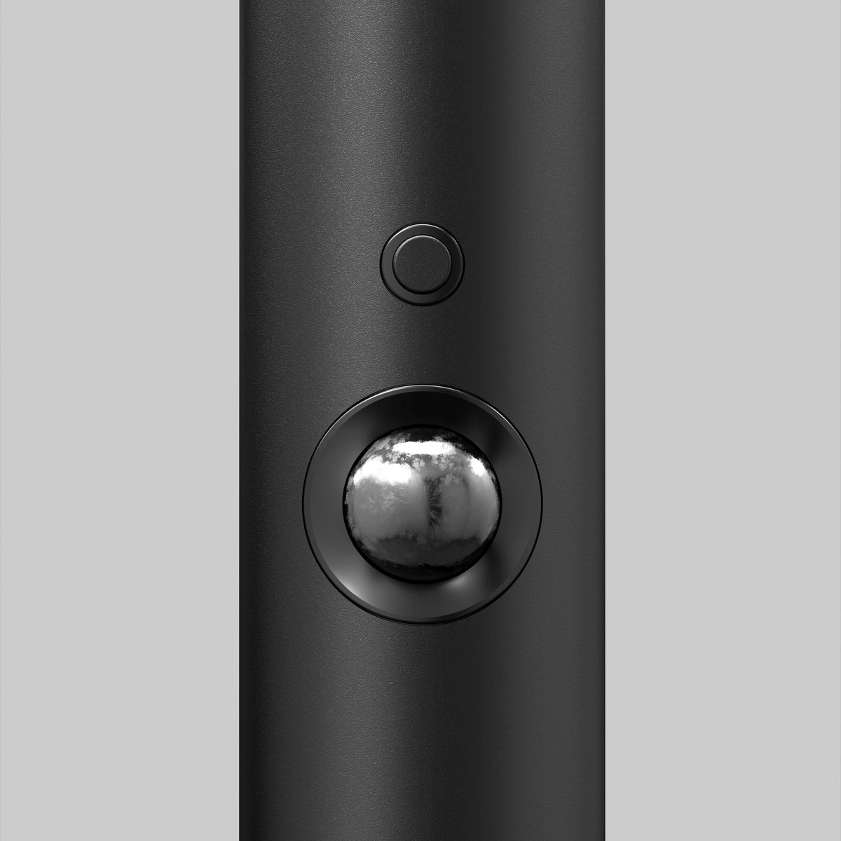 Close-up of the Artika Urbia Solar LED Bollard, a black cylinder with a round button and metallic sphere motion sensor on its front.