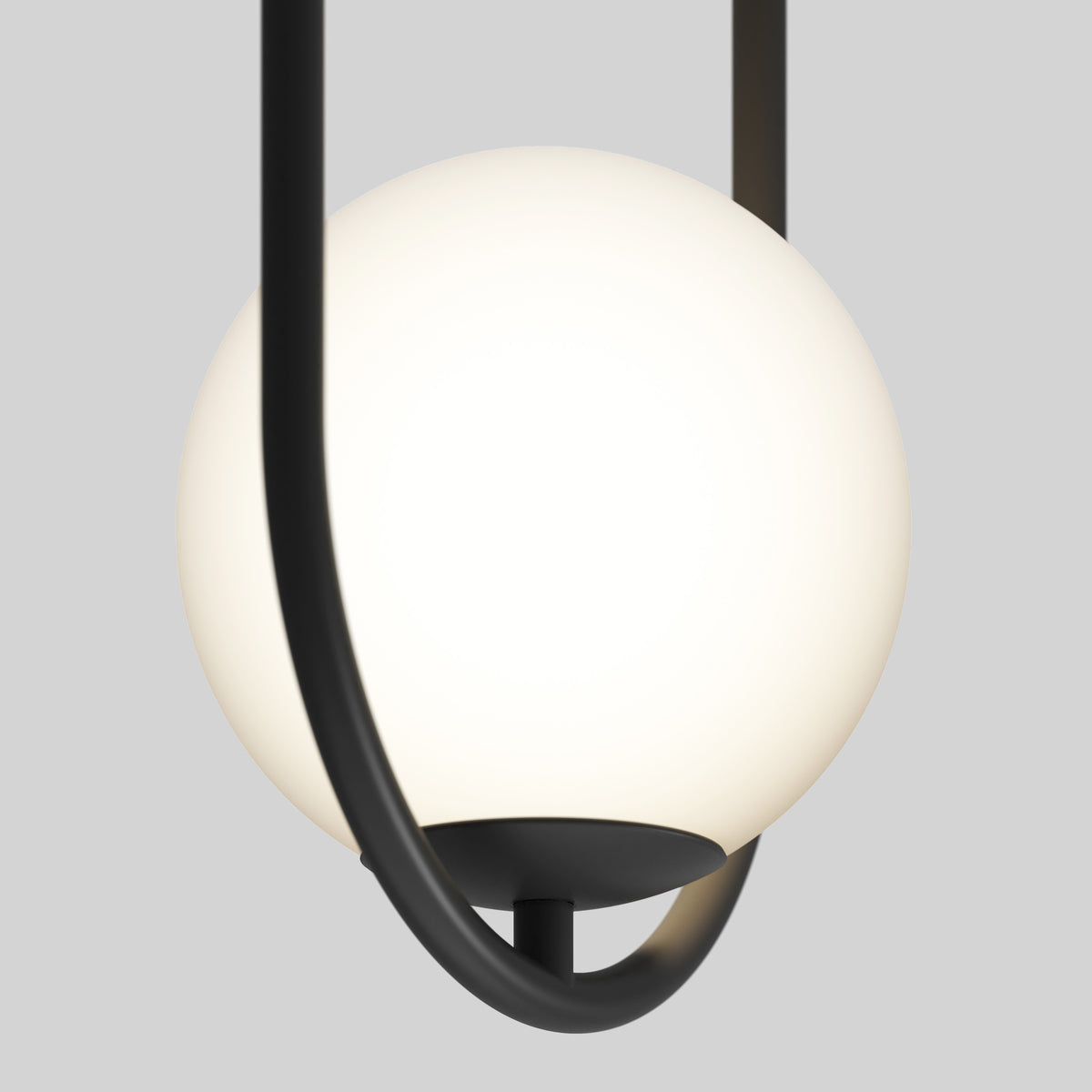 A modern pendant light featuring a frosted white glass globe encased in a curved, matte black metal frame, set against a plain light gray background.
