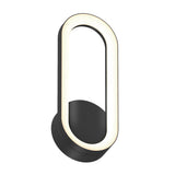 A modern wall sconce featuring an oval-shaped light with a black base and frame, emitting a soft, even glow around the inner edge.