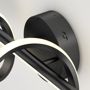 Close-up of the Artika Coda 27-in (69 cm) Integrated LED 5-CCT Vanity Light Bar, a modern black fixture with curved strips and round base—an elegant bathroom lighting choice.