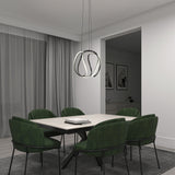 A modern dining room with a rectangular table, six green upholstered chairs, a sleek pendant light, and gray curtains. Monochrome wall art is visible in the adjacent room, creating a minimalist atmosphere.