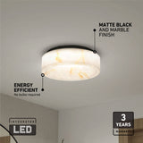 A round ceiling light with a marble-patterned shade and matte black base is mounted on a white ceiling. Text highlights its integrated LED, energy efficiency, marble finish, and a 3-year warranty.
