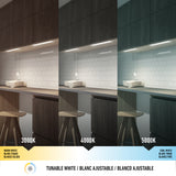 A kitchen with under-cabinet lighting is shown in three panels, each displaying different light temperatures: warm white (3000K), neutral white (4000K), and cool white (5000K) on white subway tiles and dark cabinets.