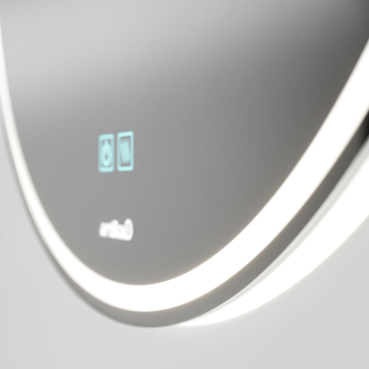 A close-up of a modern, illuminated bathroom mirror with a glowing LED border and touch control icons on the surface. The mirror features a sleek, minimalist design.