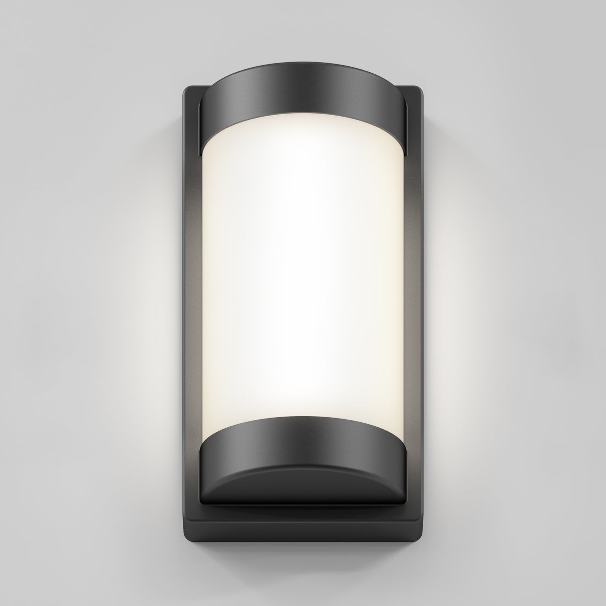 A modern wall-mounted outdoor light fixture with a rectangular frame and rounded edges, featuring a frosted white central panel that diffuses light, set against a plain gray background.