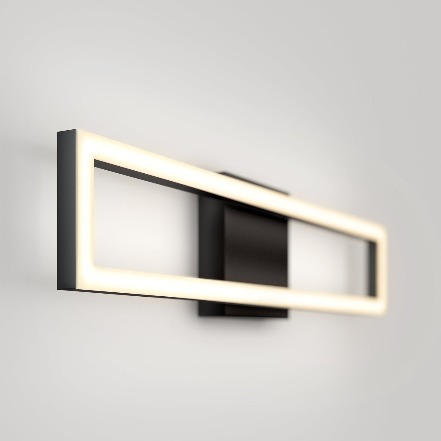 The Artika-CAN-dev Dover modern LED bathroom vanity light 5 CCT is a rectangular wall sconce with a black frame, integrated LED, and emits a soft even glow when mounted on a white wall.