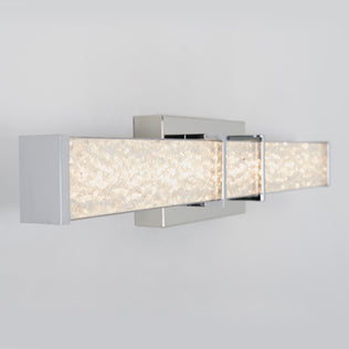 Artika Royale 27-in LED Vanity Light Bar with chrome finish and textured glass, mounted on a light gray bathroom wall.