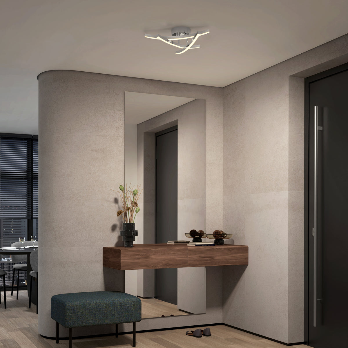 Modern hallway with a floating wooden console table, decorative vases, and ornaments. A teal bench sits below, a large mirror is on the wall, and a contemporary ceiling light fixture is overhead.