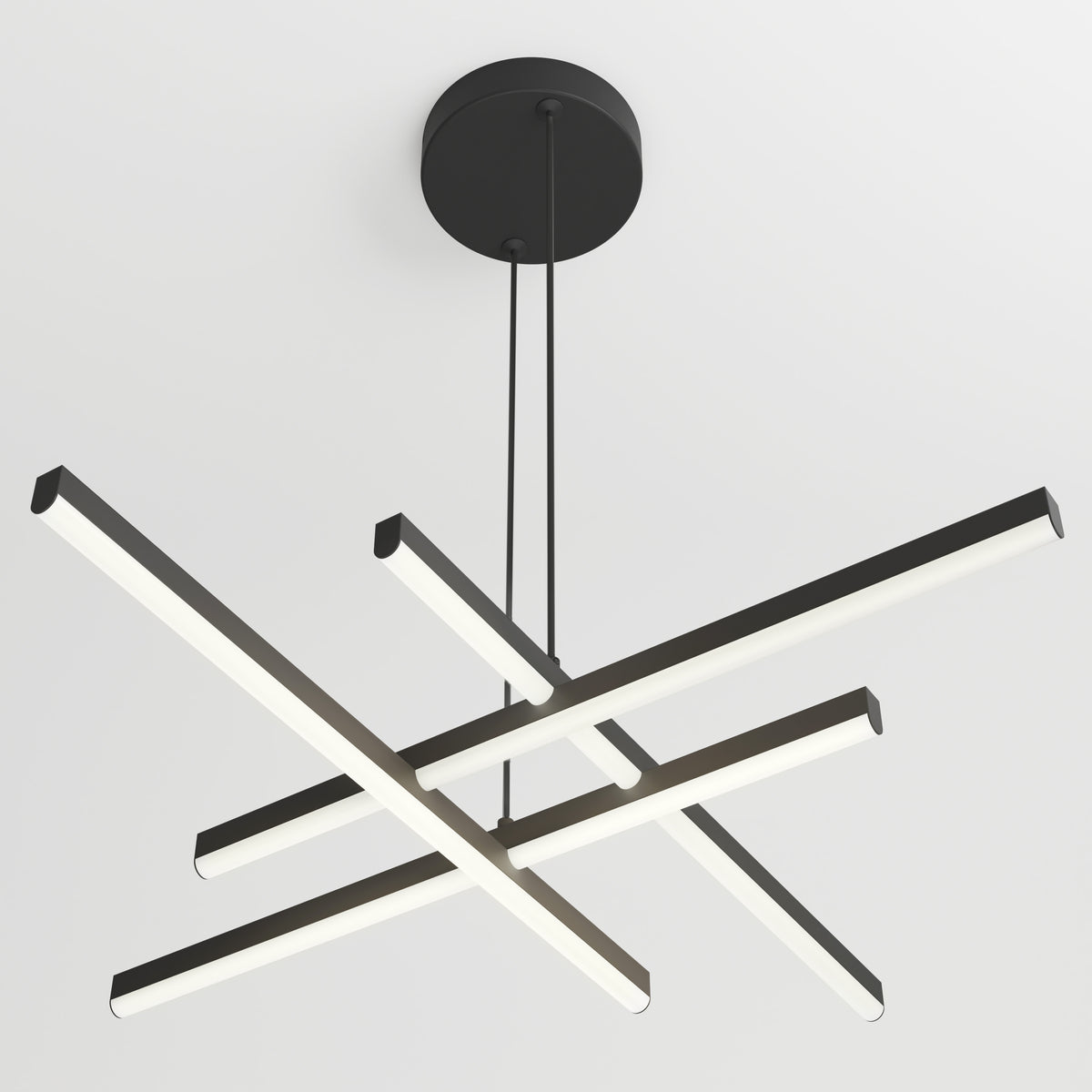 A modern ceiling light fixture with four intersecting black linear bars, each emitting white light, suspended from a round black base by two cords against a white ceiling.