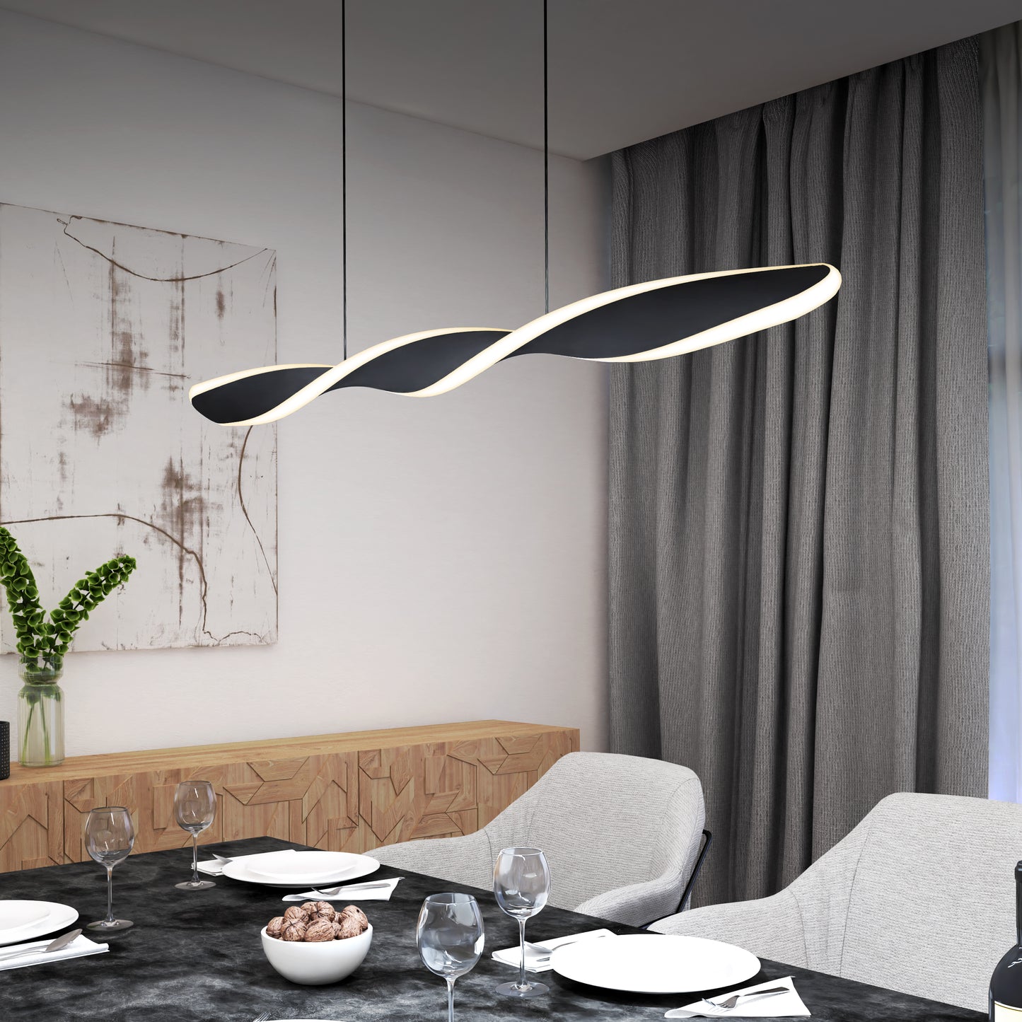A modern dining room features the Artika Finley Linear LED pendant light 3 CCT above a set table with plates, wine glasses, and decor; gray chairs and curtains, artwork, and a vase with green stems complete the scene.