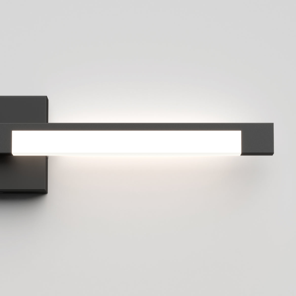 The Artika Tivoli modern LED bathroom vanity light 5 CCT features a sleek rectangular design with a black base, mounts on the wall, and offers adjustable lighting for personalized ambiance against any plain white wall.