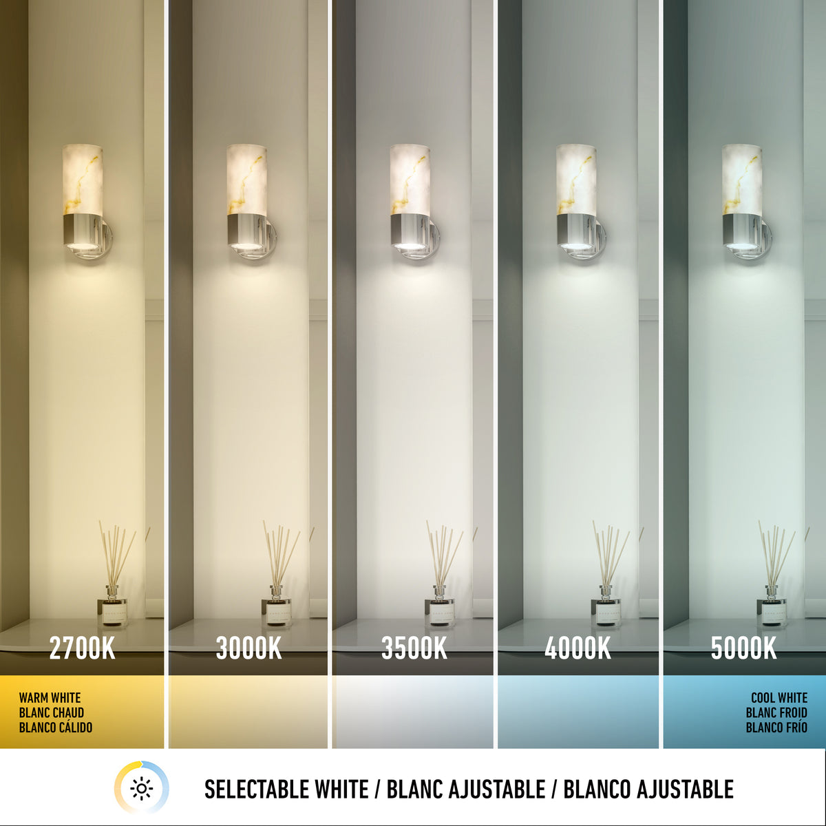Artika’s Marble LED Contemporary Sconce 5 CCT features five wall sconces with selectable white color options, ranging from warm yellow (2700K) to cool white (5000K), each beautifully illuminating vases with diffuser sticks on a shelf.