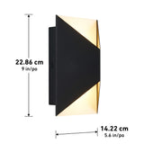 A modern wall sconce with a geometric black design emits light from the top and bottom. Dimensions are shown: 22.86 cm (9 in) tall and 14.22 cm (5.6 in) wide.
